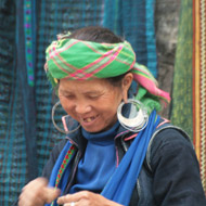 A Black Hmong working on brocades at Sapa Town, Lao Cai Province