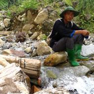 Enjoying a break on a river after the trek