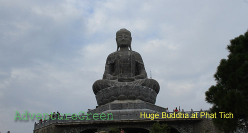 A giant Buddha statue on the top of the mountain