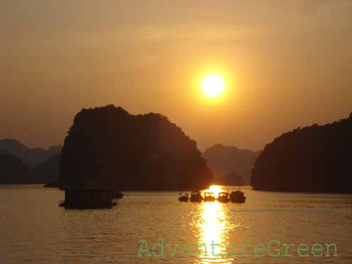 Fishing boats at sunset on Halong Bay