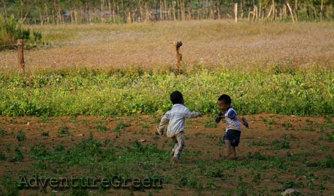Kids at Hang Kia Valley where there are several green pastures amid lovely mountains and forest
