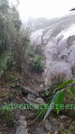 The rain was pouring down when we reached the boulder near the summit