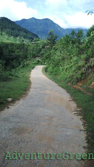 A paved path to the village from Tram Tau