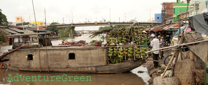 A boat transporting bananas to the market at Bac Lieu A boat transporting bananas to the market at Bac Lieu