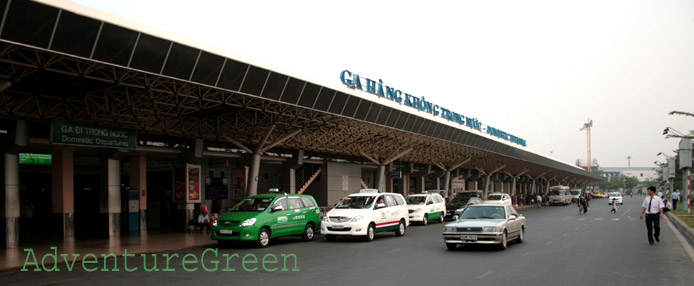 Cars and taxis in front of Tan Son Nhat Airport in Saigon Cars and taxis in front of Tan Son Nhat Airport in Saigon