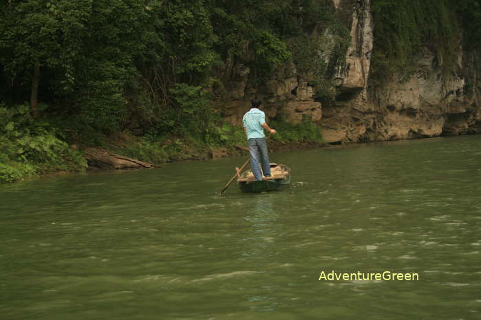 Rowing boat and fishing on the Ba Be Lake in the Ba Be National Park