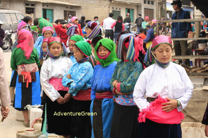 Ethnic ladies selling local corn wine at the Dong Van Market