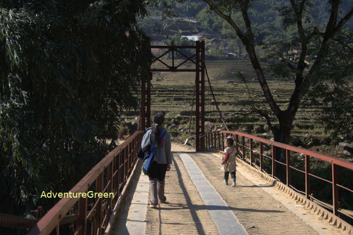 A steel bridge spanning the river in the Muong Hoa Valley where you enter the Ta Van Village