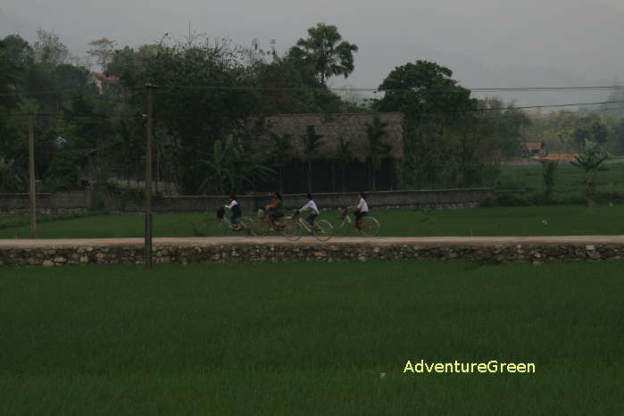 School kids cycle back home at Ham Yen Tuyen Quang Vietnam