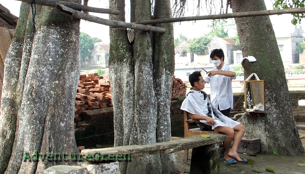 A barber shop at Tho Ha Village